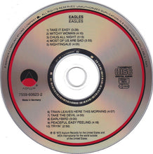 Cargar imagen en el visor de la galería, CD disc of Eagles' album with tracklist on a white background