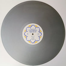 Cargar imagen en el visor de la galería, Gray vinyl record with a label on a white background