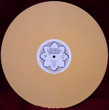 Charger l'image dans la galerie, Vinyl record with a label on a dark background