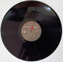 Cargar imagen en el visor de la galería, Vinyl record with 'Earthen Grave' label on a white background