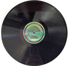 Load image into Gallery viewer, Vinyl record with a visible label on a white background