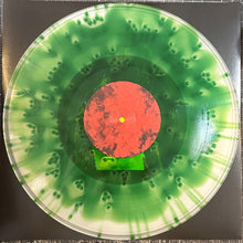 Cargar imagen en el visor de la galería, Vinyl record with a green and red design on a dark background