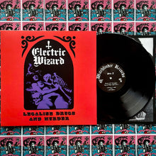 Charger l&#39;image dans la galerie, Vinyl record with &#39;Electric Wizard&#39; cover and multiple copies in the background