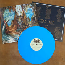 Load image into Gallery viewer, Blue vinyl record with artwork and text on a brown surface