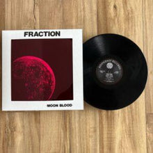 Cargar imagen en el visor de la galería, Vinyl record and cover titled 'Fraction Moon Blood' on a wooden surface