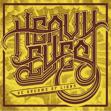 Load image into Gallery viewer, The Heavy Eyes - He Dreams Of Lions front album cover with stylized text &#39;The Heavy Eleven&#39; on a textured yellow background