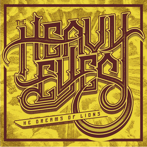 The Heavy Eyes - He Dreams Of Lions front album cover with stylized text 'The Heavy Eleven' on a textured yellow background