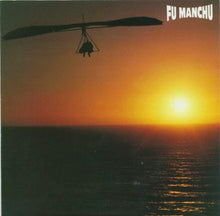 Charger l'image dans la galerie, Silhouette of a hang glider over water with a sunset, featuring the band 'Fu Manchu'.