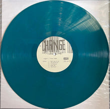 Load image into Gallery viewer, Teal vinyl record with a label on a white background