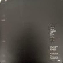Cargar imagen en el visor de la galería, Back cover of a vinyl record with text on a dark background