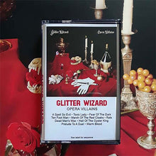 Charger l'image dans la galerie, Cassette tape cover of 'Glitter Wizard Opera Villains' with a red tablecloth and candles in the background.