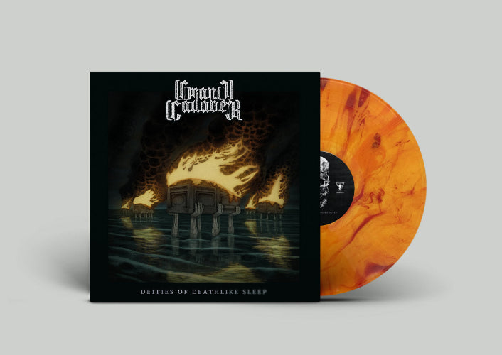 Vinyl record with orange and black marbled design and album cover featuring artistic design.