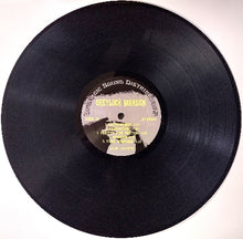 Cargar imagen en el visor de la galería, Vinyl record with a visible label on a white background