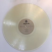 Load image into Gallery viewer, Clear vinyl record with a label on a white background