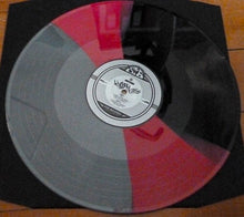 Cargar imagen en el visor de la galería, Vinyl record with a gray and red color scheme on a wooden surface