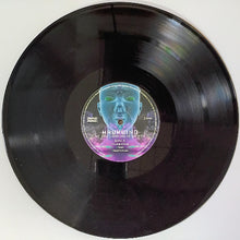 Cargar imagen en el visor de la galería, Vinyl record with a colorful label on a white background