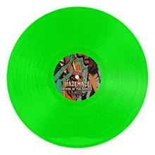Charger l'image dans la galerie, Green vinyl record with a colorful label on a white background