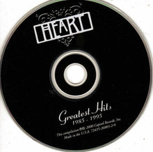Cargar imagen en el visor de la galería, CD with 'Heart' branding and 'Greatest Hits 1985-1995' text on a white background