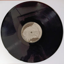Load image into Gallery viewer, Vinyl record with a label featuring a face design on a white background