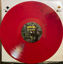 Load image into Gallery viewer, Red vinyl record with a black label featuring text and images on a white background