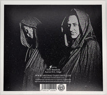 Charger l&#39;image dans la galerie, Bible Black Tyrant - Encased In Iron back album cover with black and white image of two hooded figures with text and a barcode on a dark background