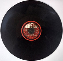 Charger l'image dans la galerie, Black vinyl record with a red label on a white background