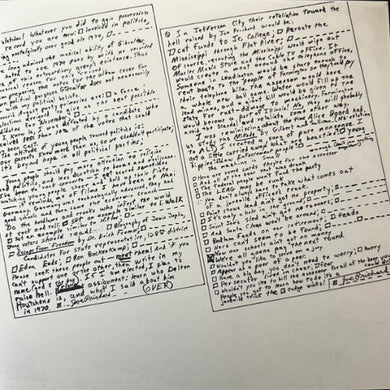 A photo of a vinyl record's liner notes with handwritten content.