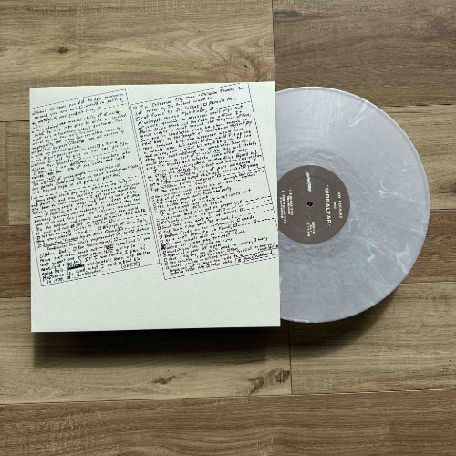 A photo of a vinyl record's liner notes with handwritten content.