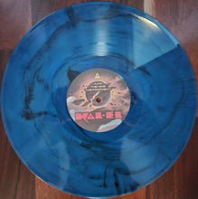 Load image into Gallery viewer, Blue vinyl record with a label on a wooden surface