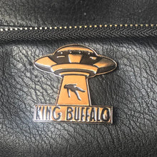 Charger l'image dans la galerie, Metallic 'King Buffalo' logo on a black leather surface
