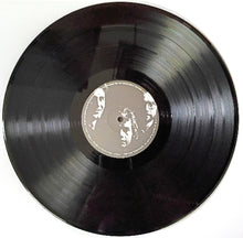 Cargar imagen en el visor de la galería, Vinyl record with a white label on a white background