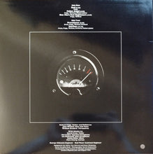 Cargar imagen en el visor de la galería, Vinyl record cover with a circular gauge design on a dark background