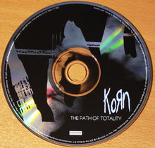 Load image into Gallery viewer, CD cover of Korn&#39;s &#39;The Path of Totality&#39; on a wooden surface