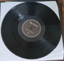 Cargar imagen en el visor de la galería, Vinyl record with a label on a white background