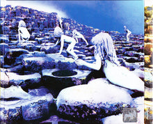 Load image into Gallery viewer, Album cover with a surreal scene of people on rocks by the sea, with a blue and purple color scheme.