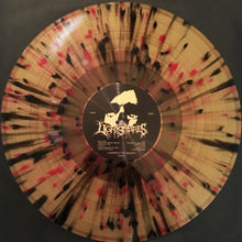 Cargar imagen en el visor de la galería, Vinyl record with a colorful splatter design on a black background
