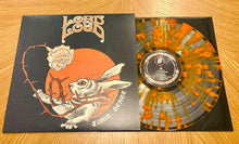 Charger l'image dans la galerie, Vinyl record with a rabbit illustration on the cover, placed on a wooden surface.