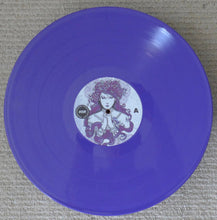 Cargar imagen en el visor de la galería, Purple vinyl record with a circular label featuring a face design on a textured surface