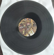 Charger l&#39;image dans la galerie, Vinyl record with a colorful label featuring a graphic design on a white background