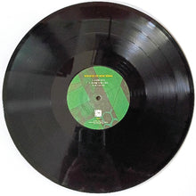 Charger l'image dans la galerie, Vinyl record with a green label on a white background