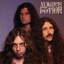Charger l'image dans la galerie, Cover art for Magick Potion vinyl record featuring the band members with long hair, dressed in casual attire, against a dark background.