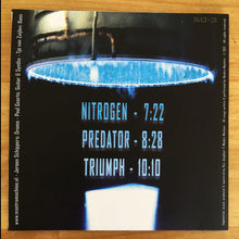 Load image into Gallery viewer, Album cover with blue light design and track listing on a wooden surface