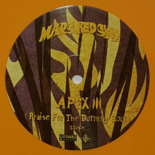 Load image into Gallery viewer, Vinyl record with zebra pattern and text on an orange background