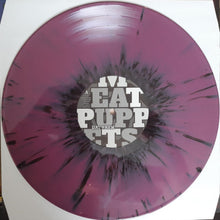 Cargar imagen en el visor de la galería, Vinyl record with a purple splatter design and &#39;Fat Puppies&#39; text on a white background