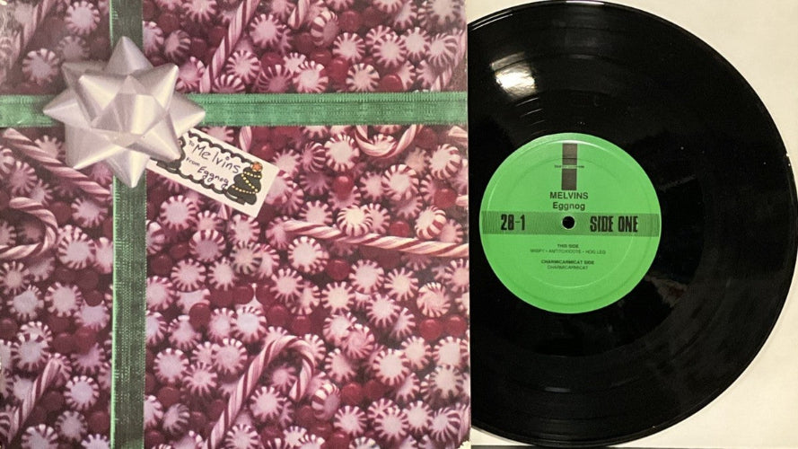 Vinyl record with a green label and floral-patterned cover