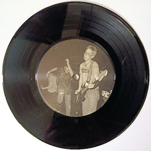 Load image into Gallery viewer, Black vinyl record with a cutout revealing a black and white photo of a band on a white background
