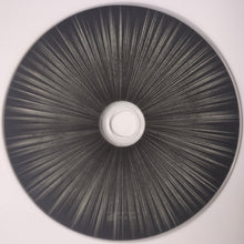 Load image into Gallery viewer, Circular object with a central white component on a gray background