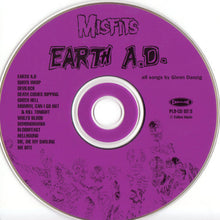 Load image into Gallery viewer, image of magenta colored CD by the band Misfits - Earth A.D. / Wolfs Blood