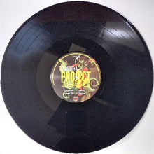 Load image into Gallery viewer, Vinyl record with a colorful label on a white background
