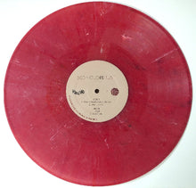 Load image into Gallery viewer, Red vinyl record with a white label on a white background
